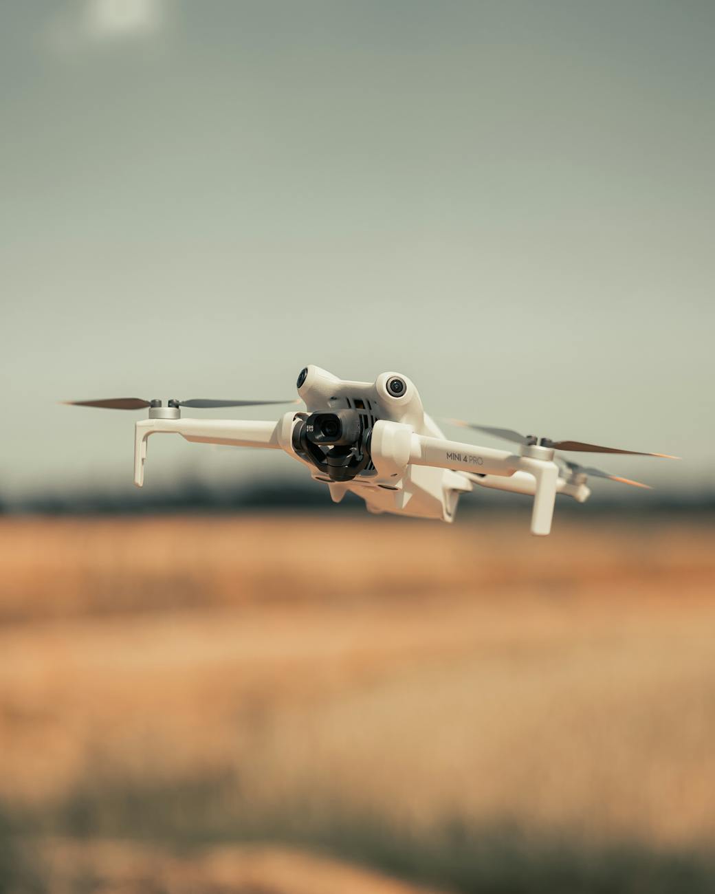 mid air drone flight over open field