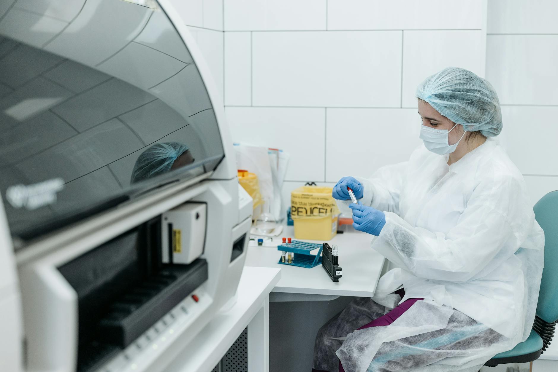 medical professional holding test tube sample