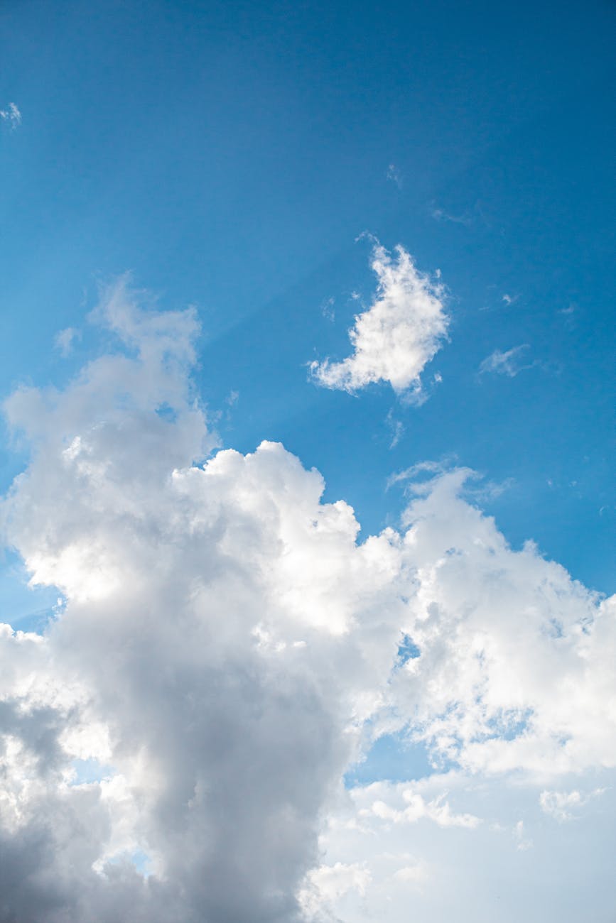 vibrant blue sky with fluffy cumulus clouds